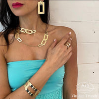 Collana lunga con rettangoli in argento dorato satinato  - LINEA TRAF'ORO